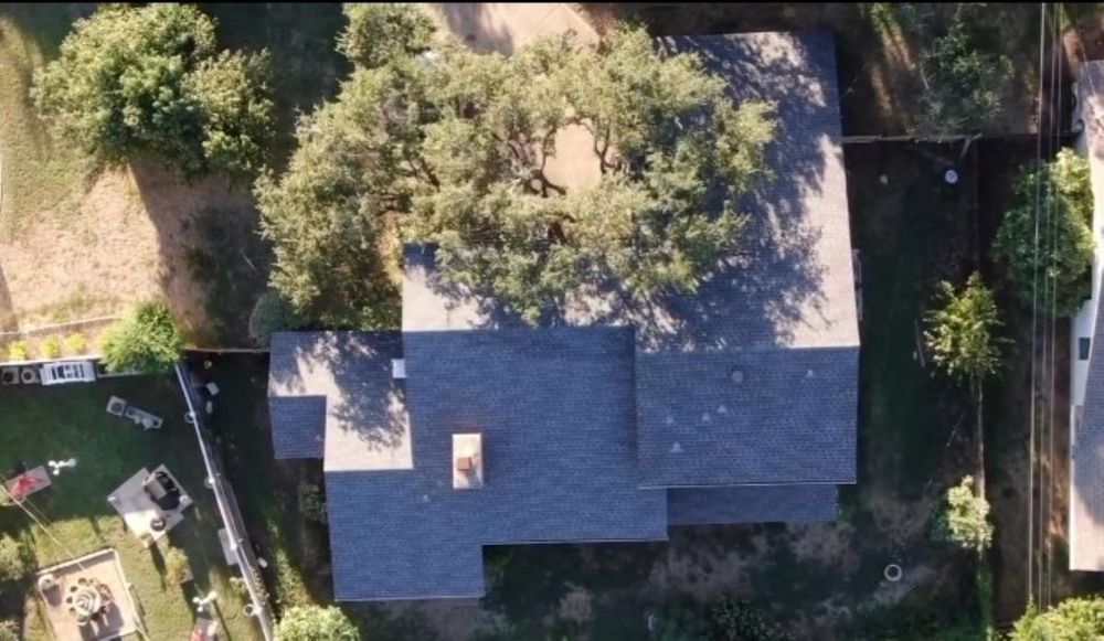 Aerial drone roof inspection view in Driftwood, Texas